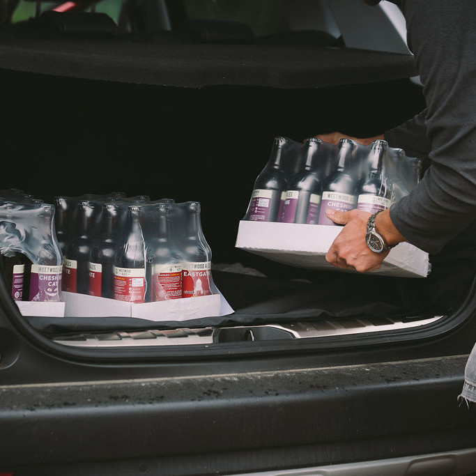 Contactless click and collect 3 Weetwood Ales being loaded into a car for contactless collection